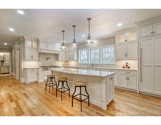 10 Russell Road Lexington, MA 02420 - Photo 5 of 29 a kitchen with kitchen island granite countertop wooden floors and view living room
