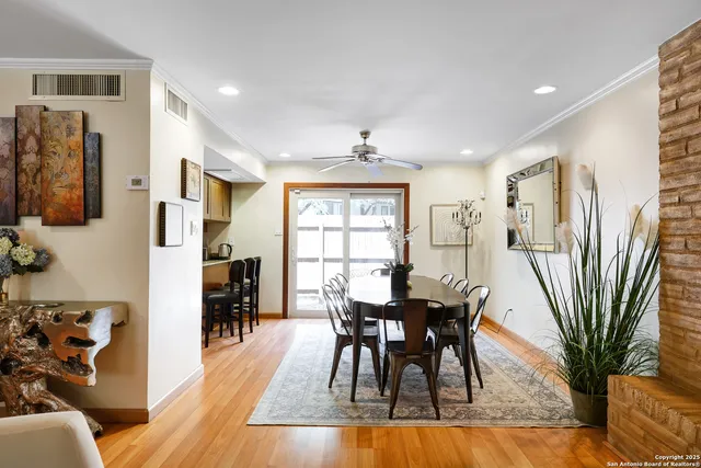 a view of a dining room with furniture and wooden floor