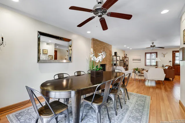 a dining room with furniture and wooden floor