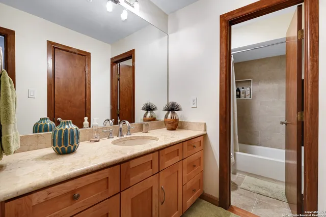 a bathroom with a sink and a mirror