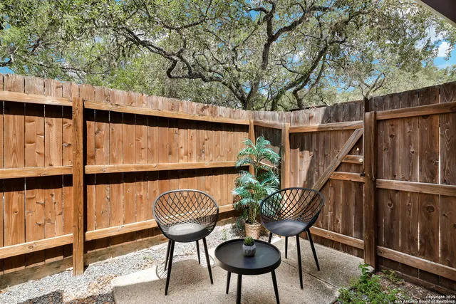 a view of a balcony with chairs