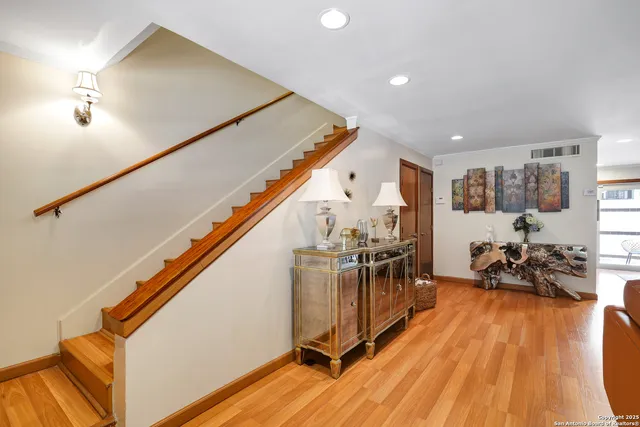 a view of living room with furniture and wooden floor