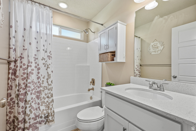 3244 West 1670th Street North Provo, UT 84601 - Photo 33 of 56 Bathroom featuring a white vanity with a light-colored countertop, an undermount sink, and a chrome faucet