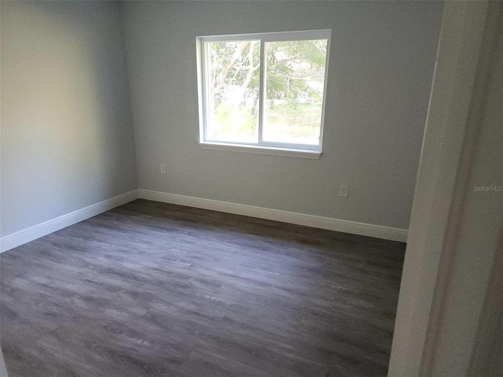 1111 Dagmar Avenue Spring Hill, FL 34606 - Photo 15 of 27 an empty room with a window