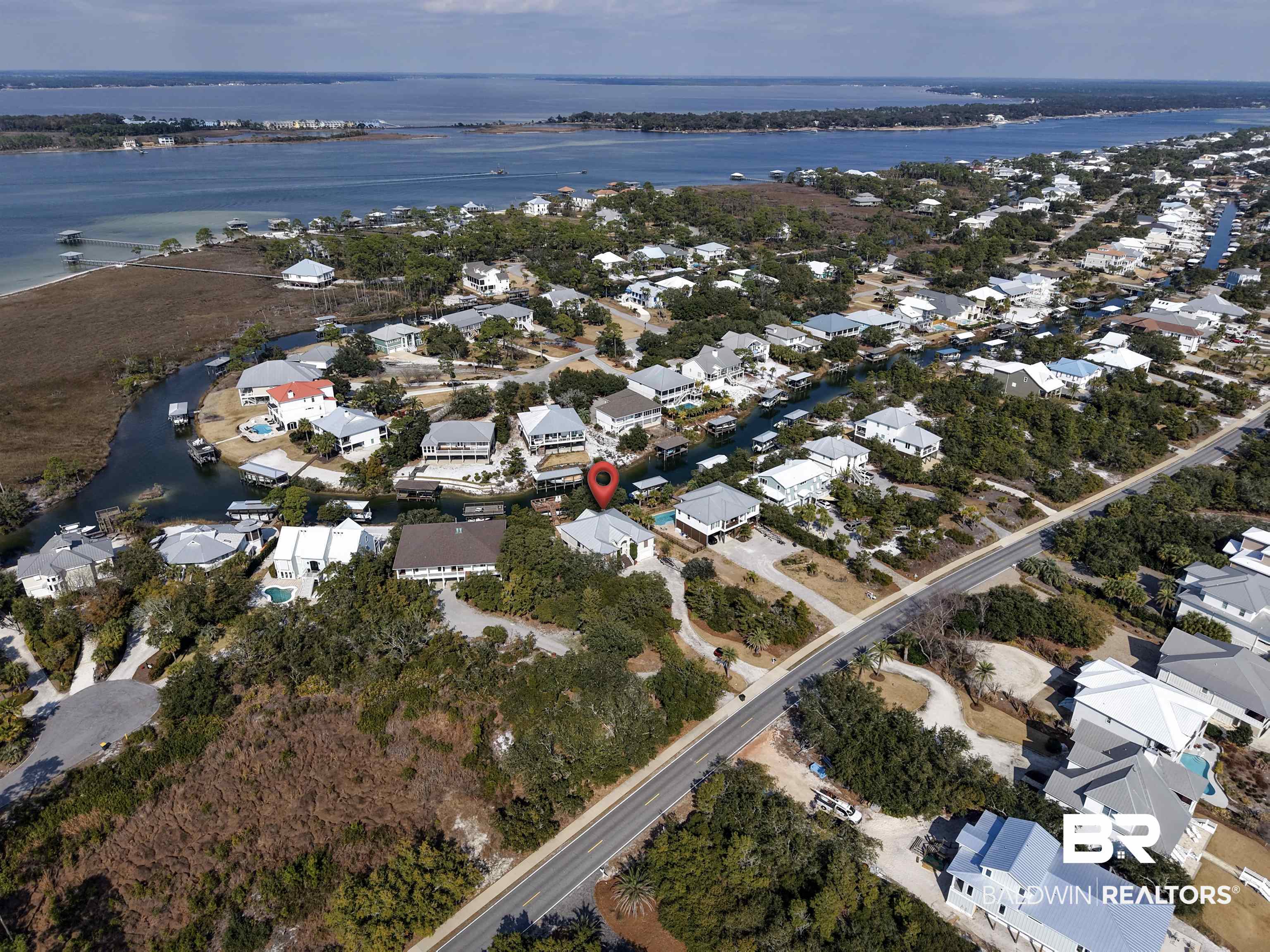 32191 River Road Orange Beach, AL 36561 - Photo 34 of 46 Aerial view of property and surrounding area featuring nearby suburban area and a nearby body of water