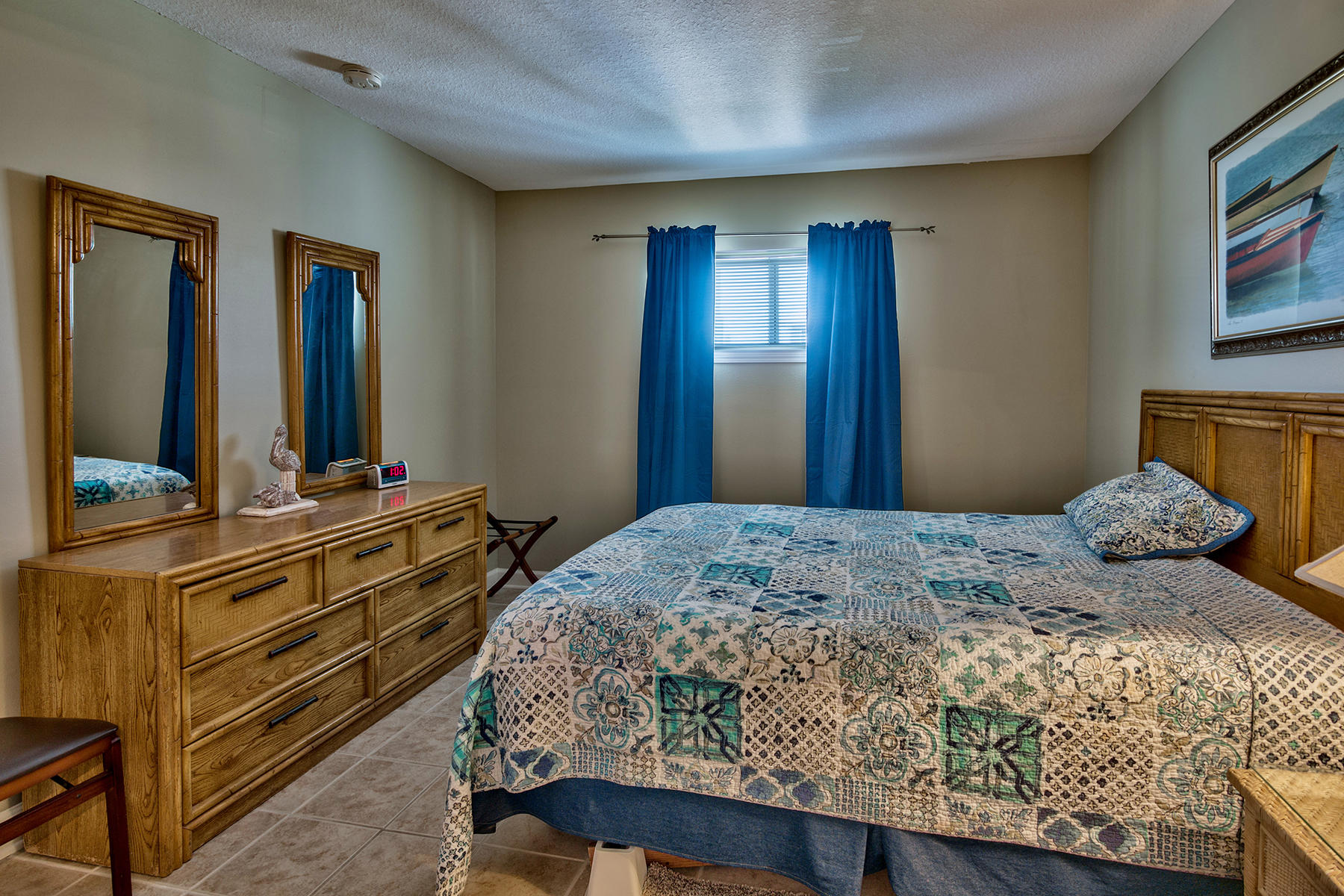 595 Eastern Lake Road, Unit 108 Santa Rosa Beach, FL 32459 - Photo 12 of 26 a bedroom with a bed and a dresser
