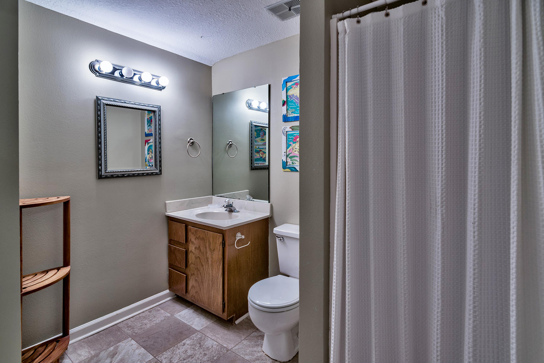 595 Eastern Lake Road, Unit 108 Santa Rosa Beach, FL 32459 - Photo 18 of 26 a bathroom with a toilet sink and mirror