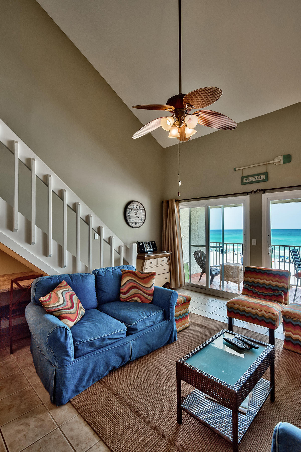 595 Eastern Lake Road, Unit 108 Santa Rosa Beach, FL 32459 - Photo 3 of 26 a living room with furniture a rug and a chandelier