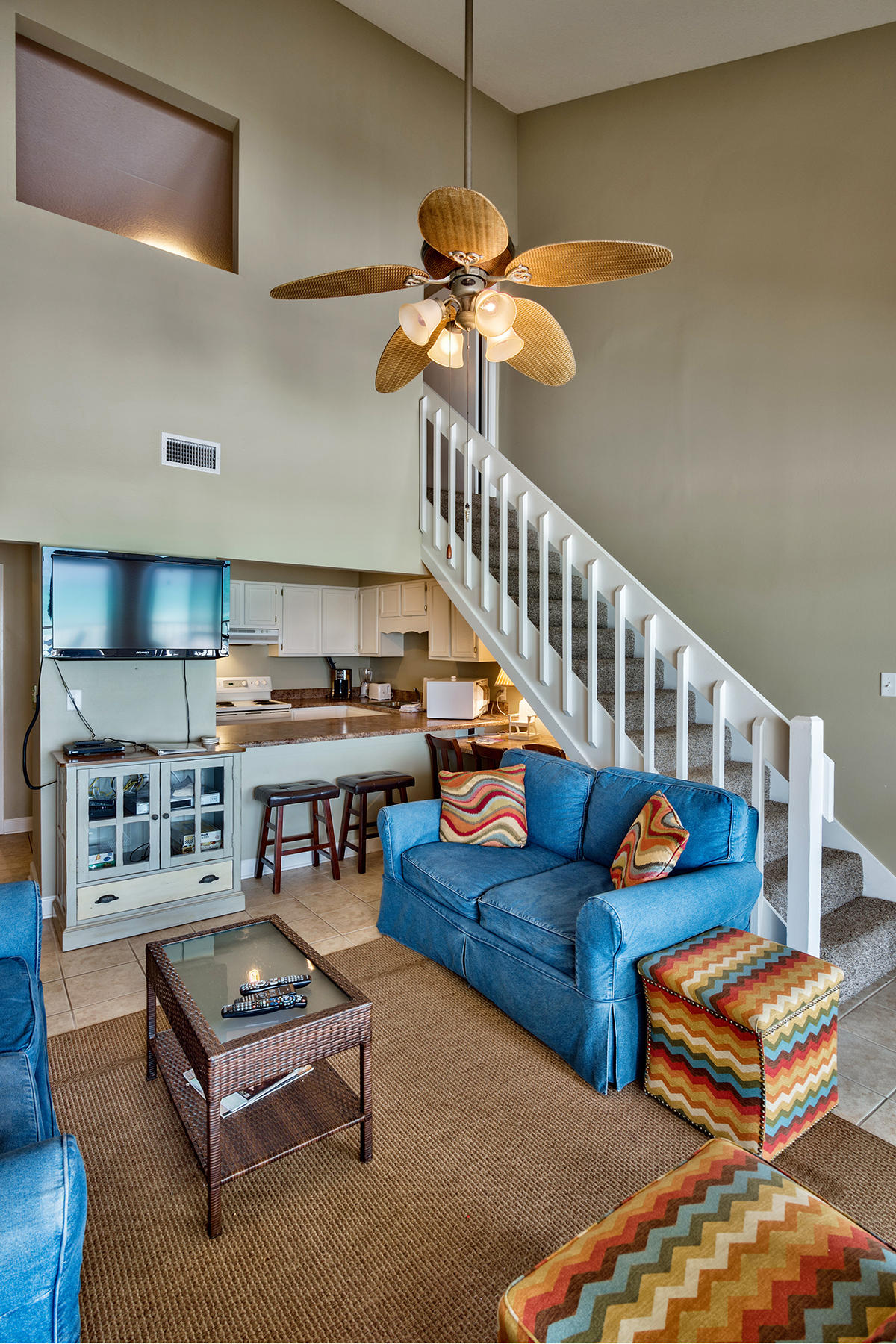 595 Eastern Lake Road, Unit 108 Santa Rosa Beach, FL 32459 - Photo 6 of 26 a living room with furniture and a chandelier