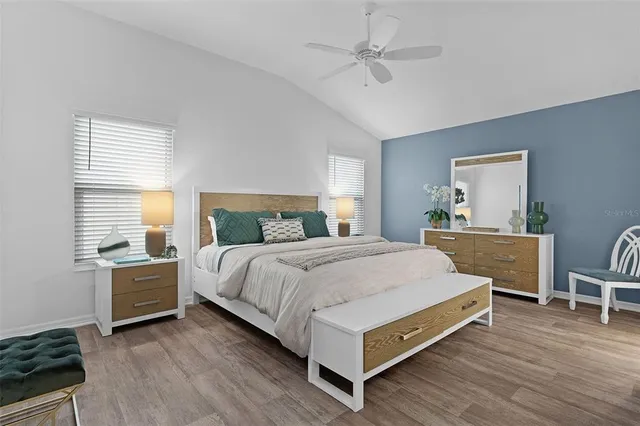 a bedroom with a bed and a table