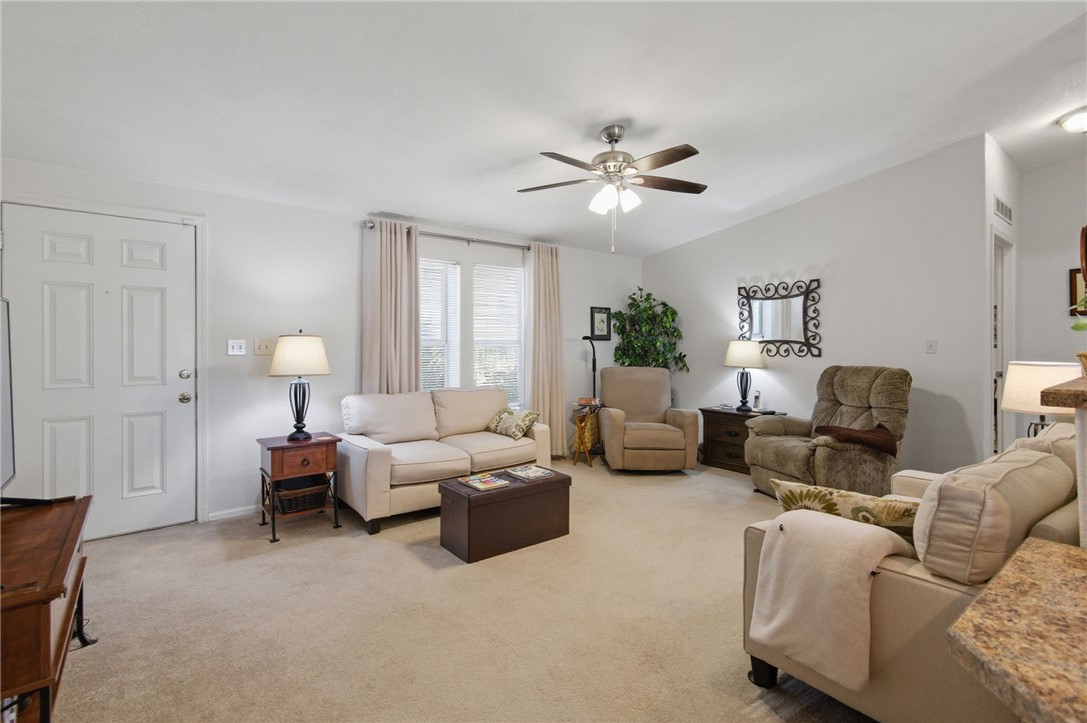 4342 Cordes Road Golden Valley, AZ 86413 - Photo 20 of 39 a living room with furniture chandelier and a window