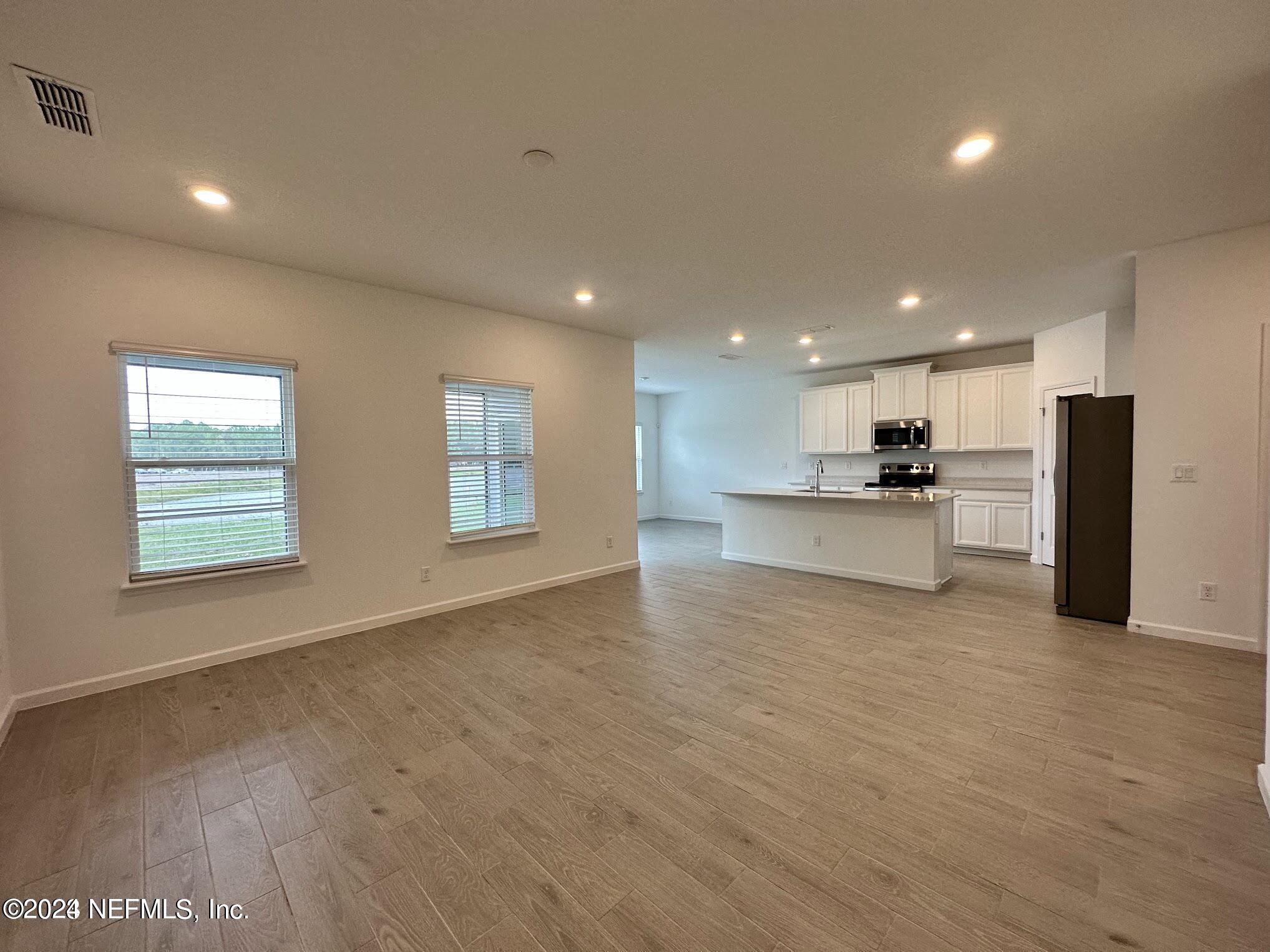 47 Beauclair Boulevard St. Augustine, FL 32084 - Photo 11 of 37 a view of kitchen with refrigerator and window
