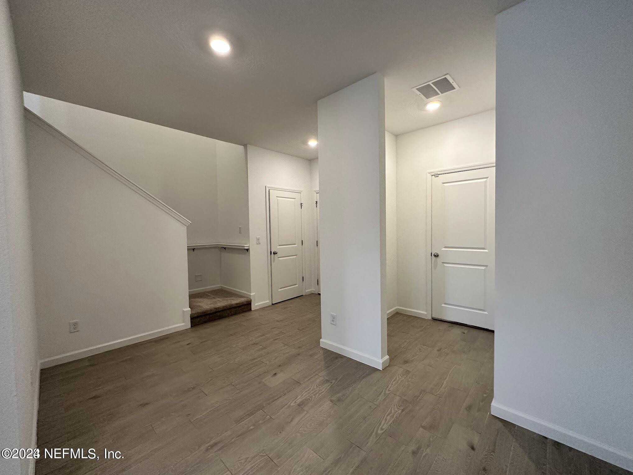 47 Beauclair Boulevard St. Augustine, FL 32084 - Photo 13 of 37 a view of an empty room with wooden floor and closet