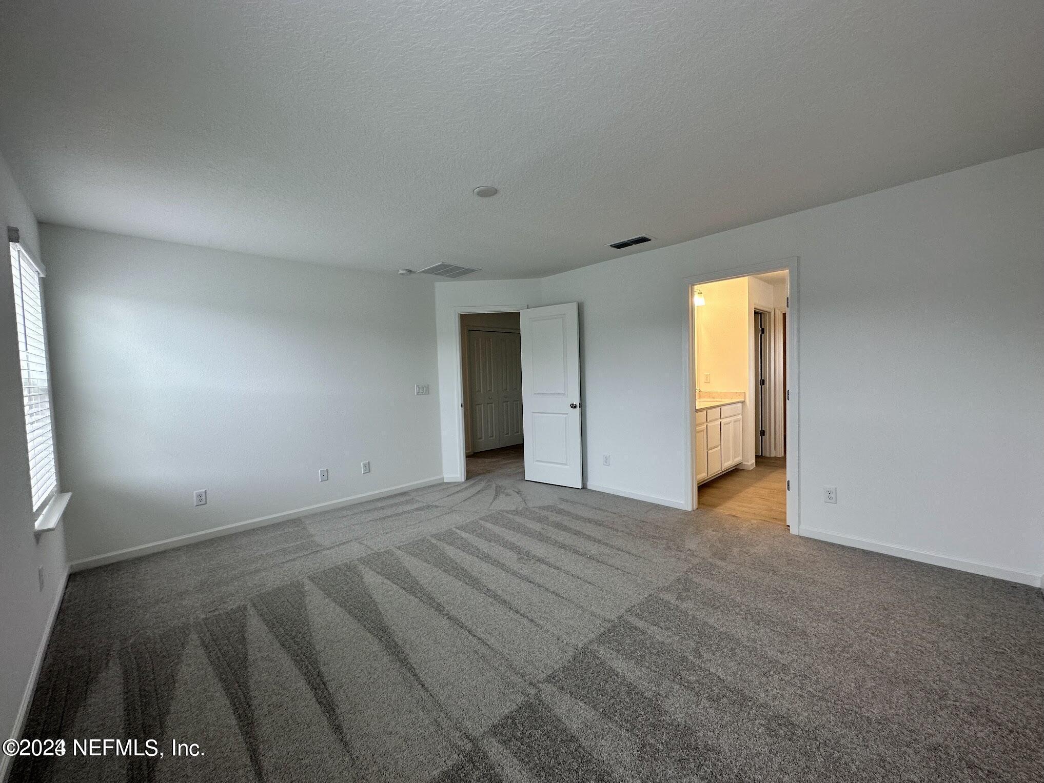 47 Beauclair Boulevard St. Augustine, FL 32084 - Photo 15 of 37 an empty room with a bathroom and a window