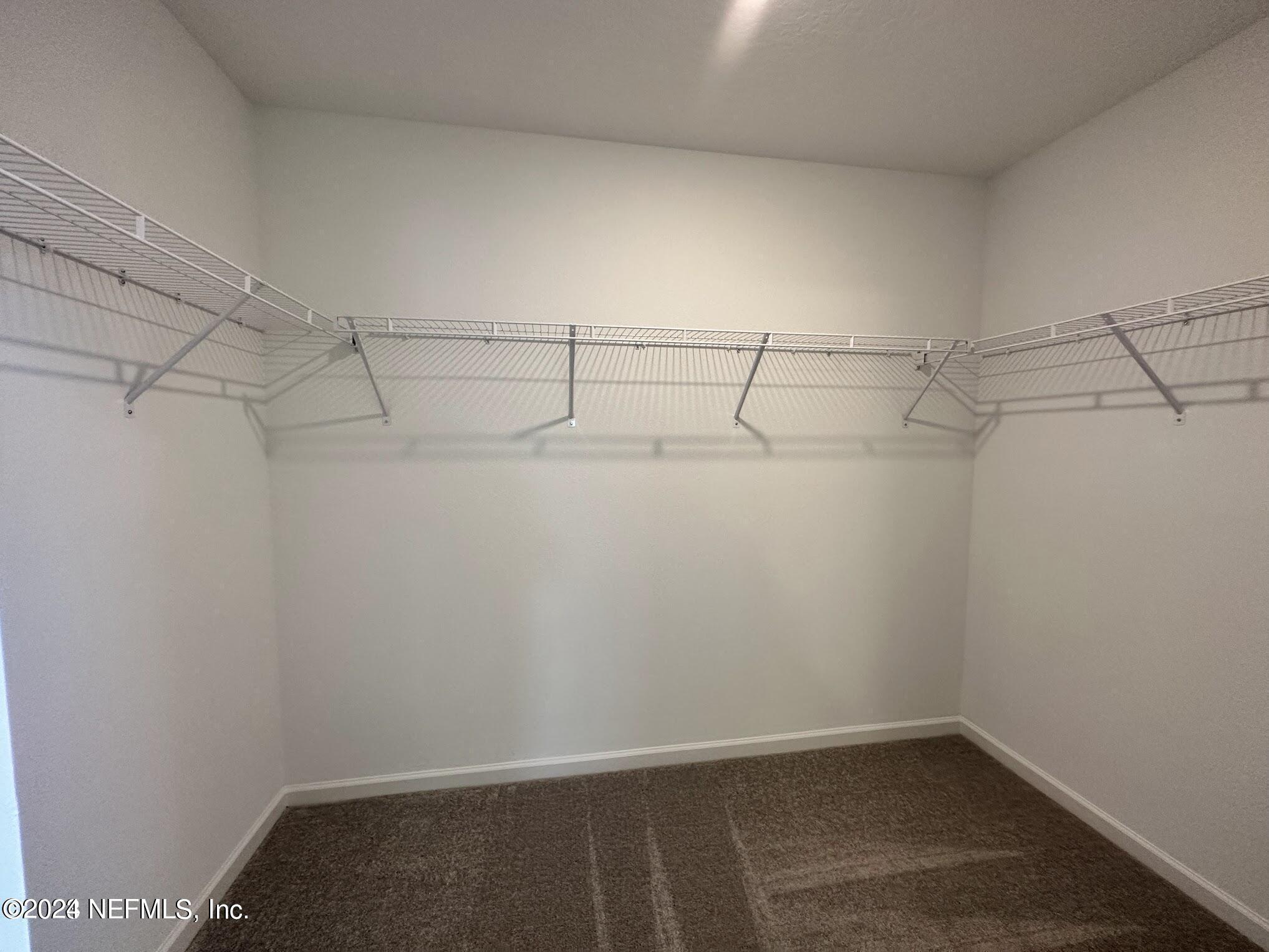 47 Beauclair Boulevard St. Augustine, FL 32084 - Photo 19 of 37 a view of a room with racks on the wall