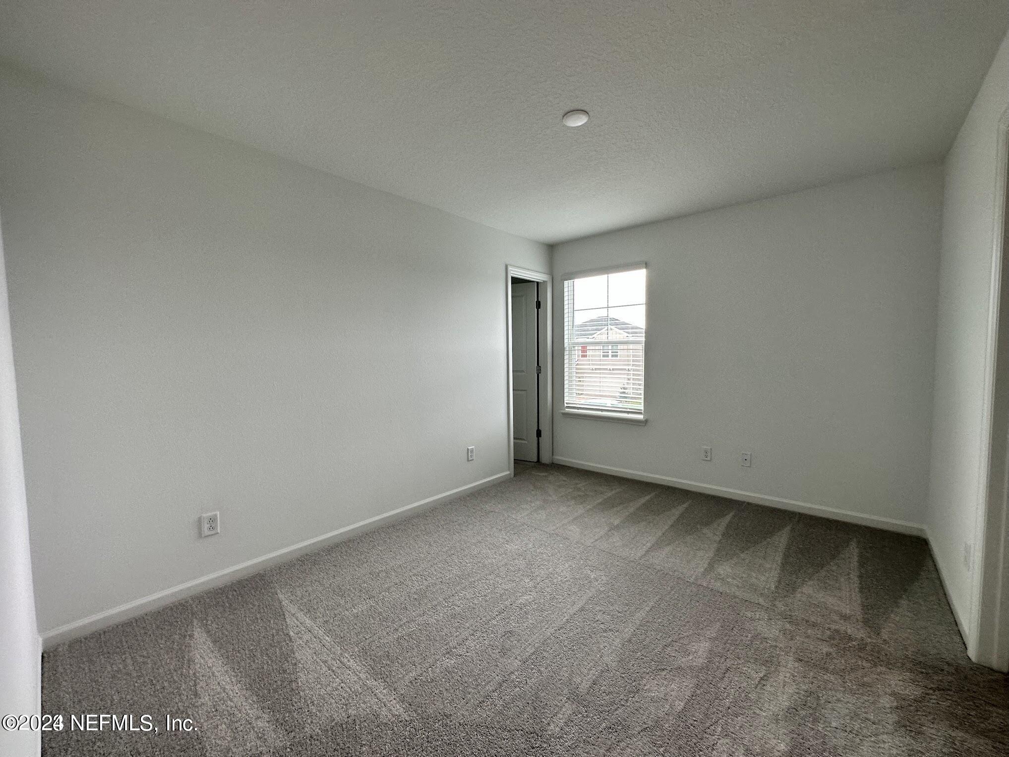 47 Beauclair Boulevard St. Augustine, FL 32084 - Photo 24 of 37 an empty room with windows