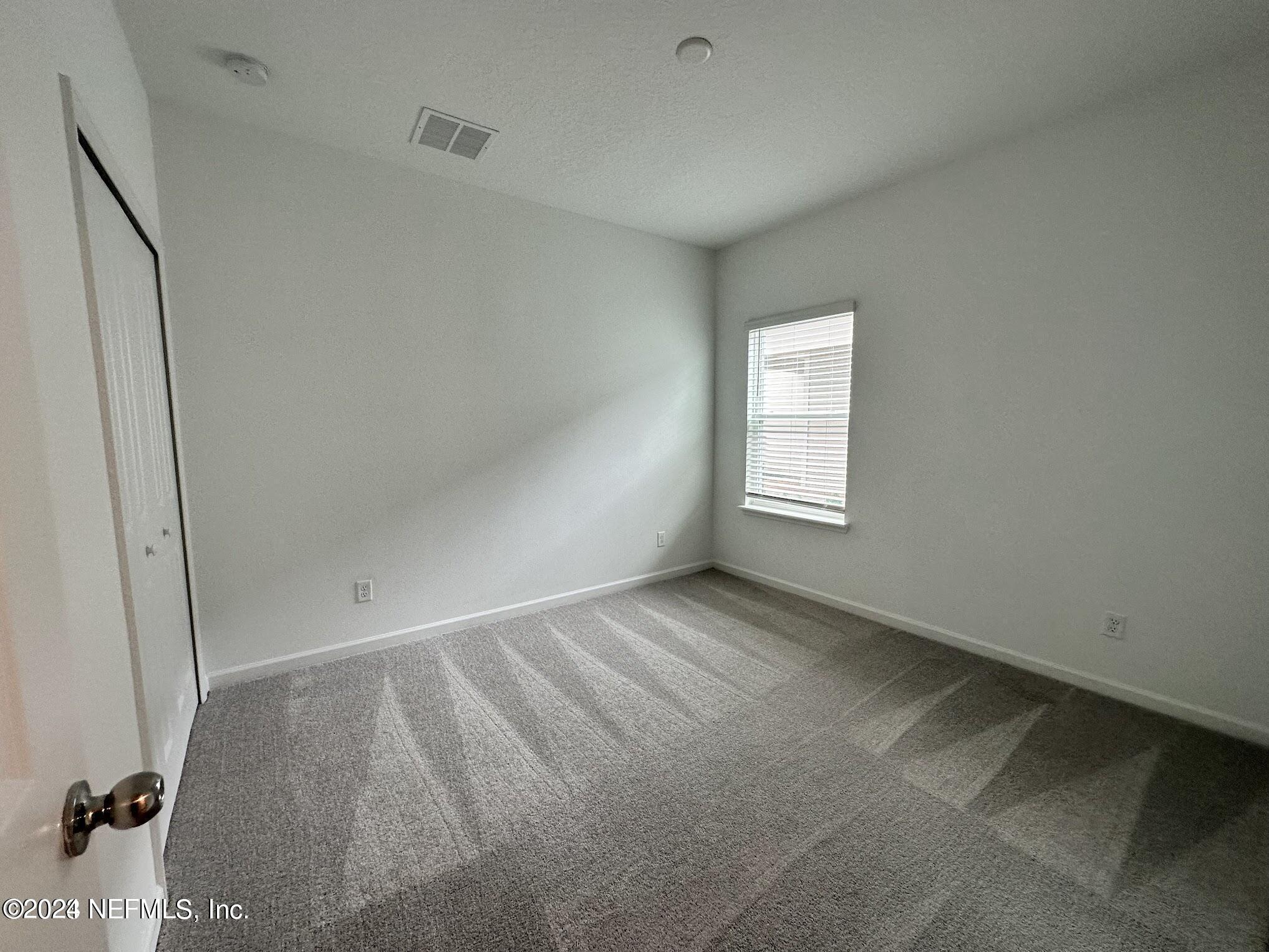 47 Beauclair Boulevard St. Augustine, FL 32084 - Photo 26 of 37 an empty room with windows