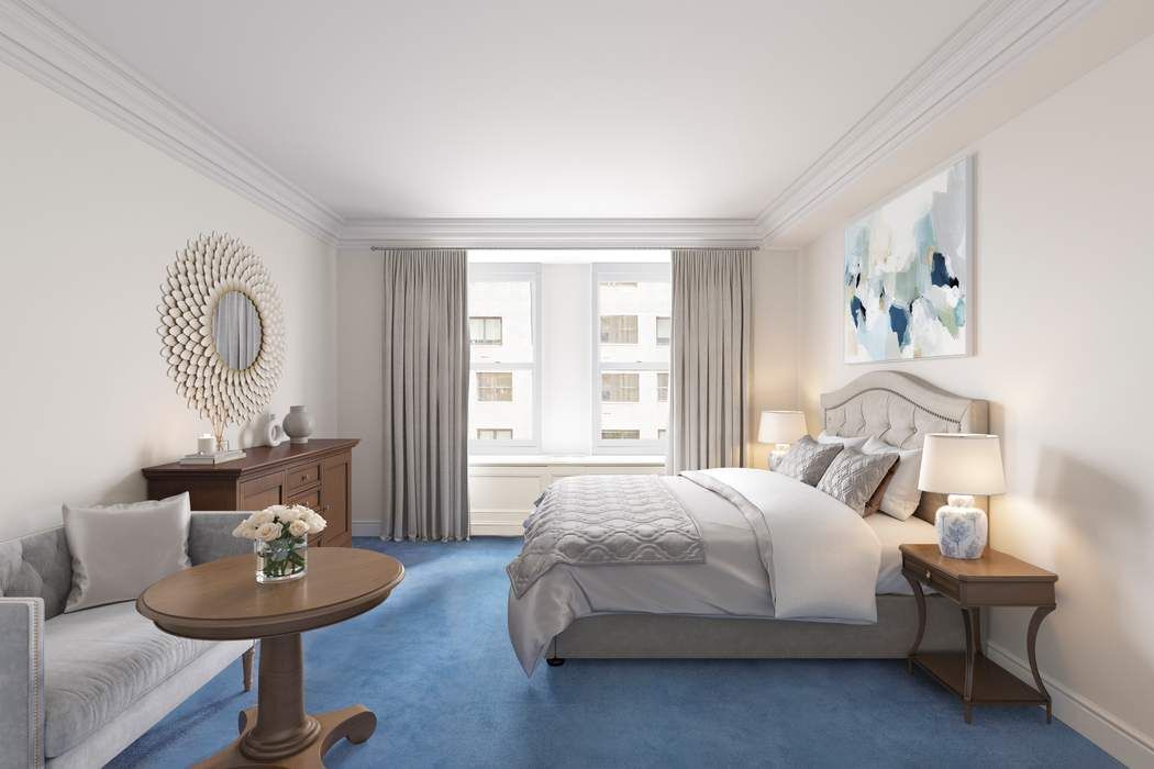 781 5th Avenue, Unit 614 Manhattan, NY 10022 - Photo 6 of 9 a bedroom with a bed and a potted plant