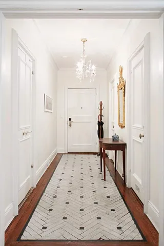 a bedroom with a bed and a potted plant