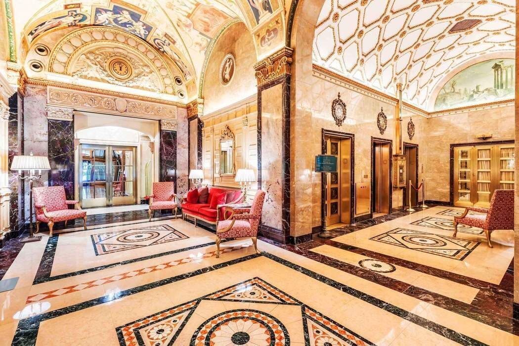 781 5th Avenue, Unit 614 Manhattan, NY 10022 - Photo 8 of 9 a view of a very nice looking living room with a large bed