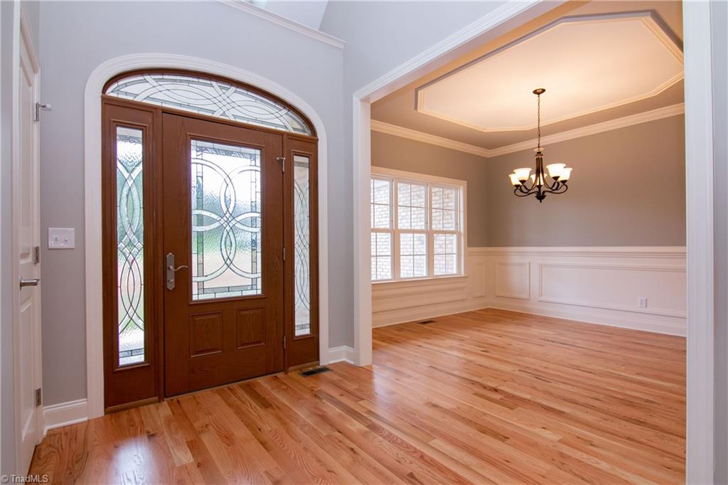 6010 Beckenham Way Oak Ridge, NC 27310 - Photo 2 of 25 Beautiful grand entrance into spacious foyer