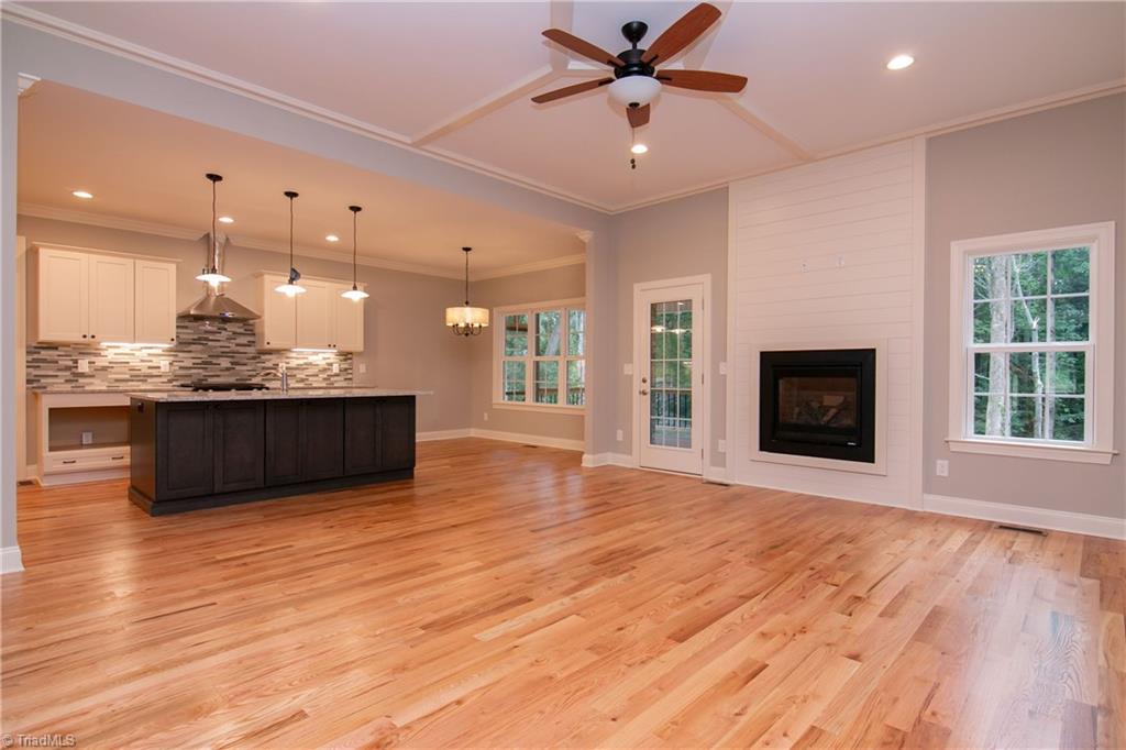 6010 Beckenham Way Oak Ridge, NC 27310 - Photo 5 of 25 Open concept living with natural flow from living to dining areas