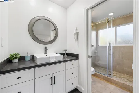 a bed room with furniture and a window