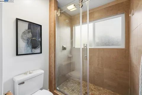 a bed room with furniture and a potted plant