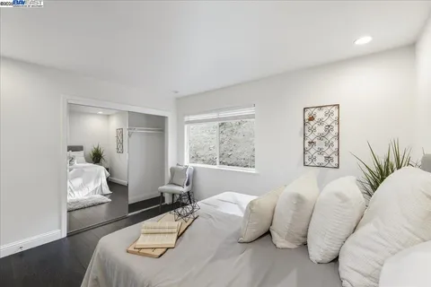 a white toilet sitting next to a window