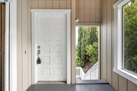 a view of a yard with wooden fence