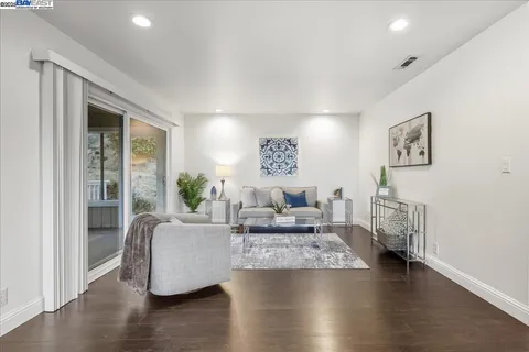 a living room with furniture and a table