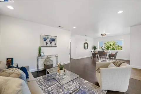 a living room with furniture and a table