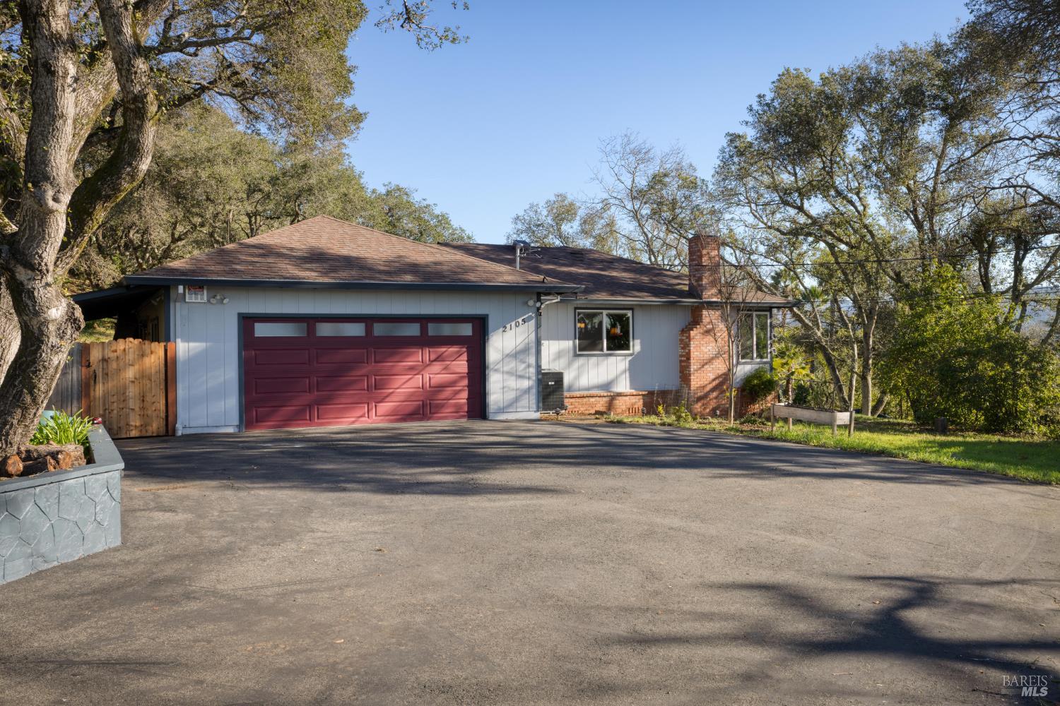a view of a house with a yard and garage
