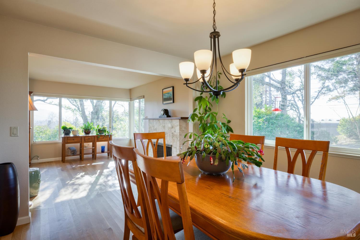 2105 Sunrise Avenue Santa Rosa, CA 95404 - Photo 13 of 30 a dining room filled chandelier and wooden floor