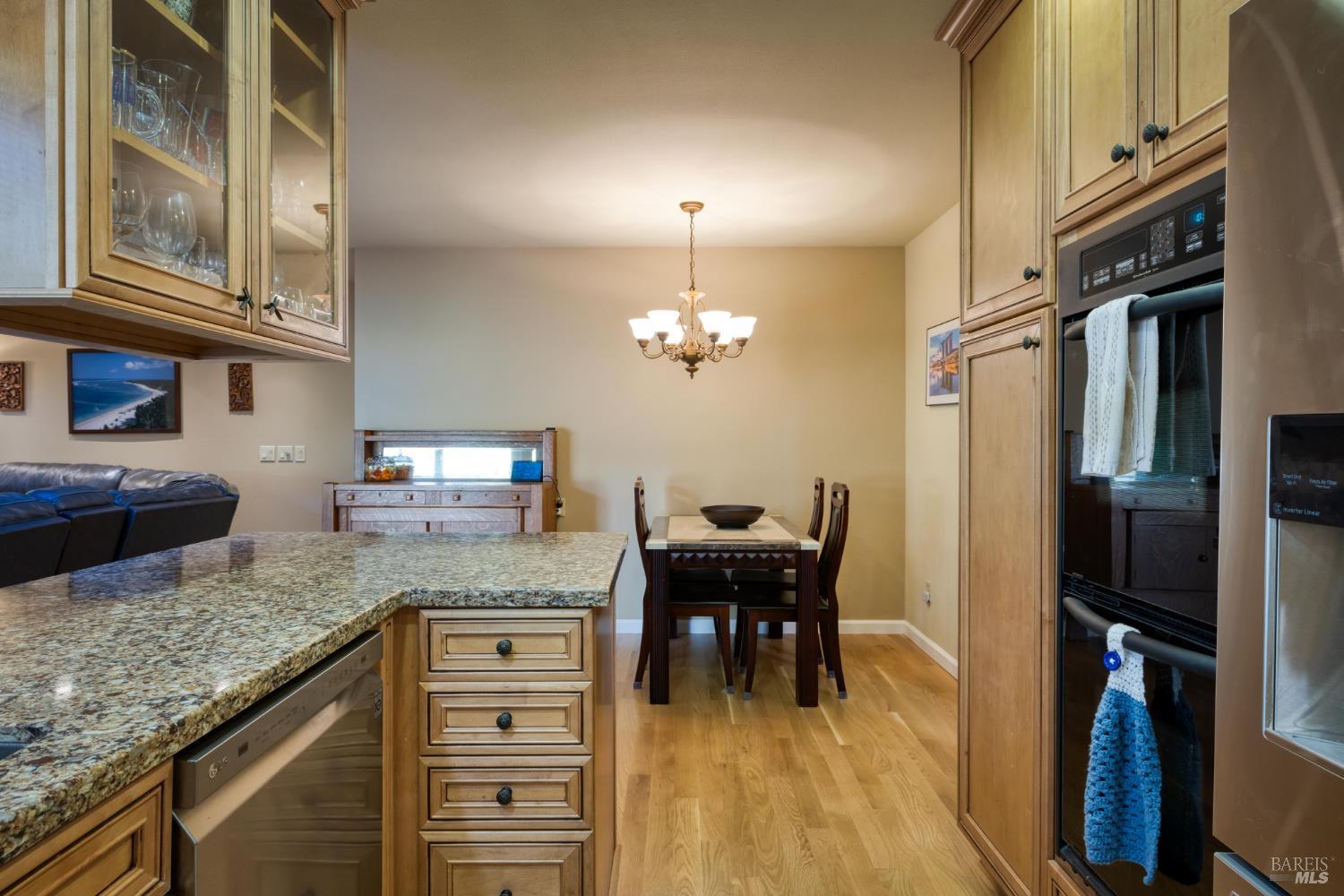 2105 Sunrise Avenue Santa Rosa, CA 95404 - Photo 17 of 30 a kitchen with granite countertop a sink stove and refrigerator