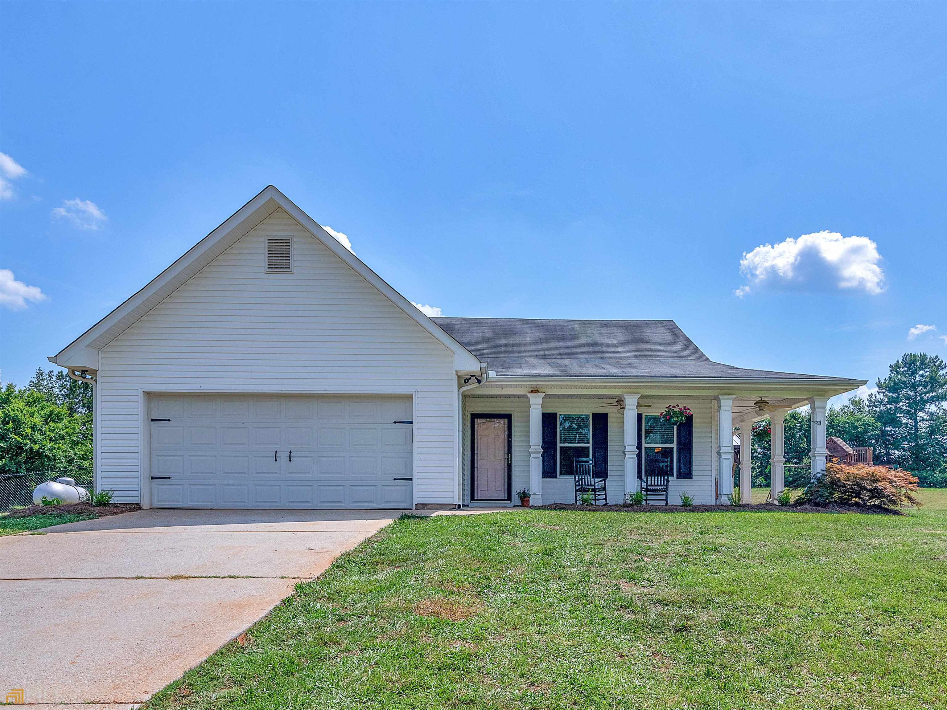 378 Colwell Road Jackson, GA 30233 - Photo 1 of 1 a view of a house with a yard and potted plants