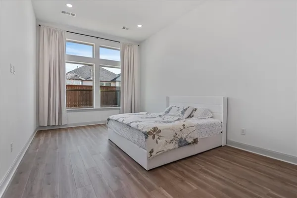 a room with a bed and window