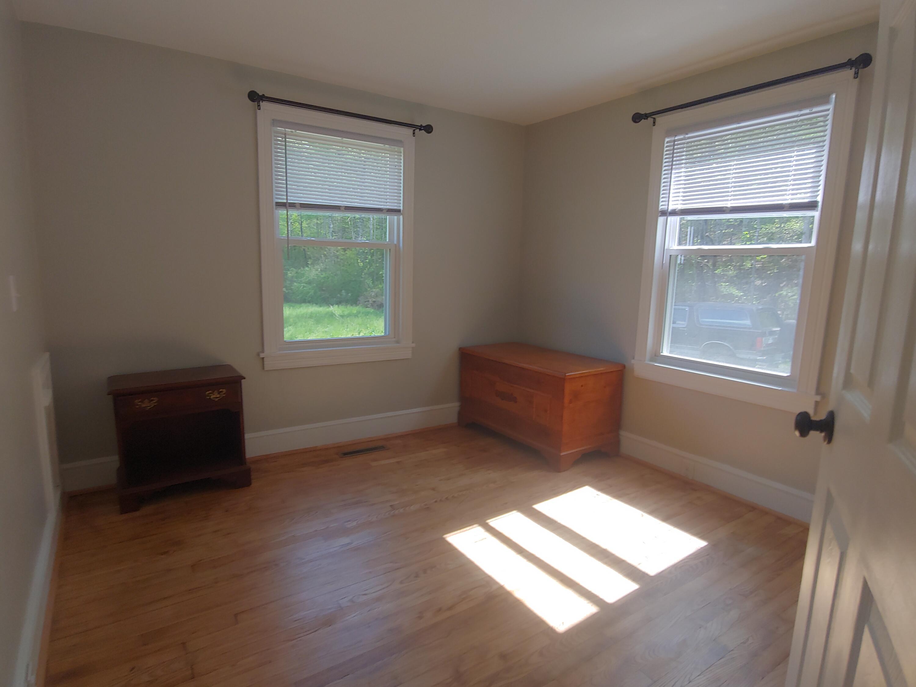 800 King Richard Road Ferrum, VA 24088 - Photo 12 of 17 a room with window and a wooden floor