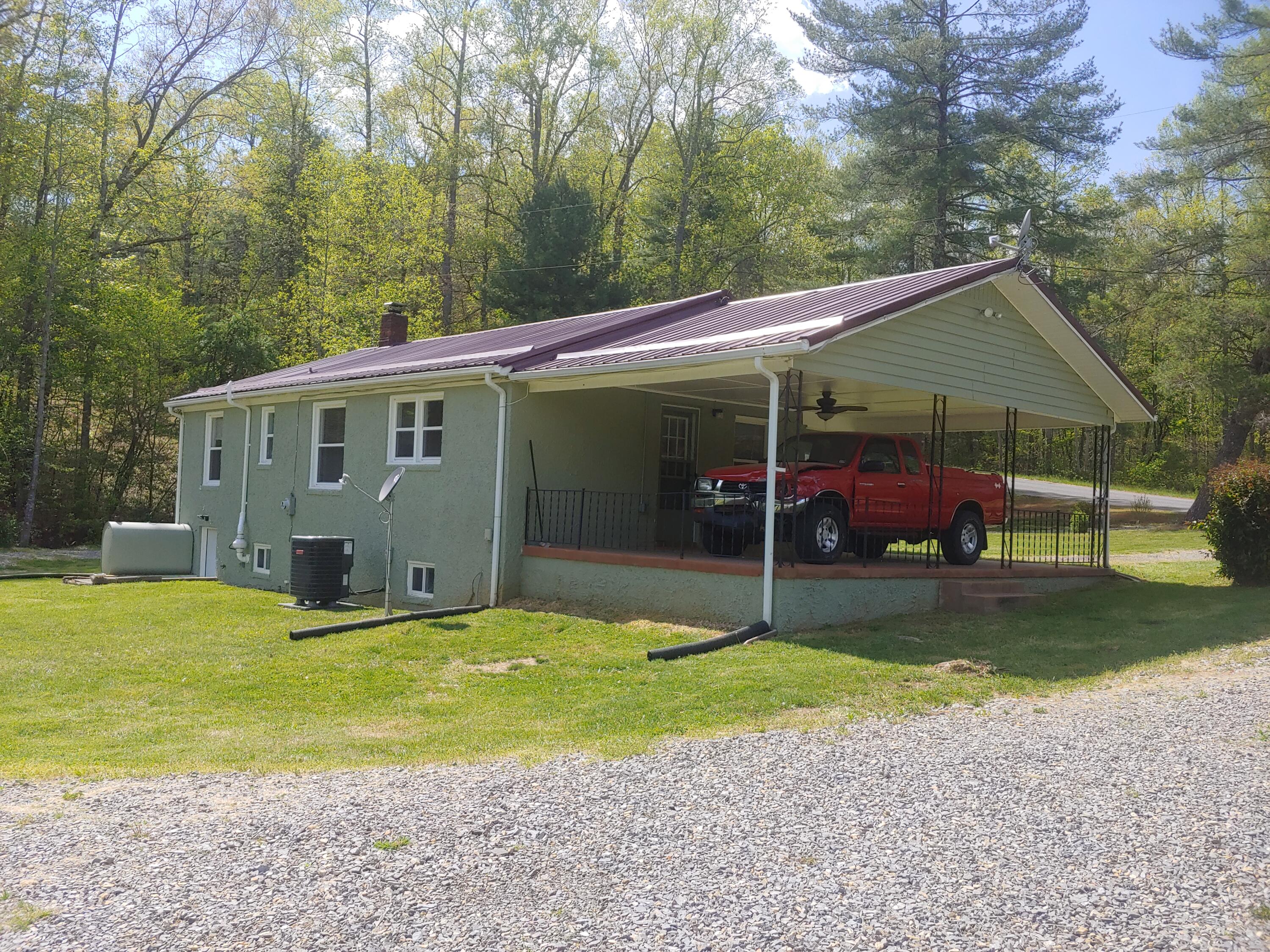 800 King Richard Road Ferrum, VA 24088 - Photo 17 of 17 a view of a house with backyard and sitting area