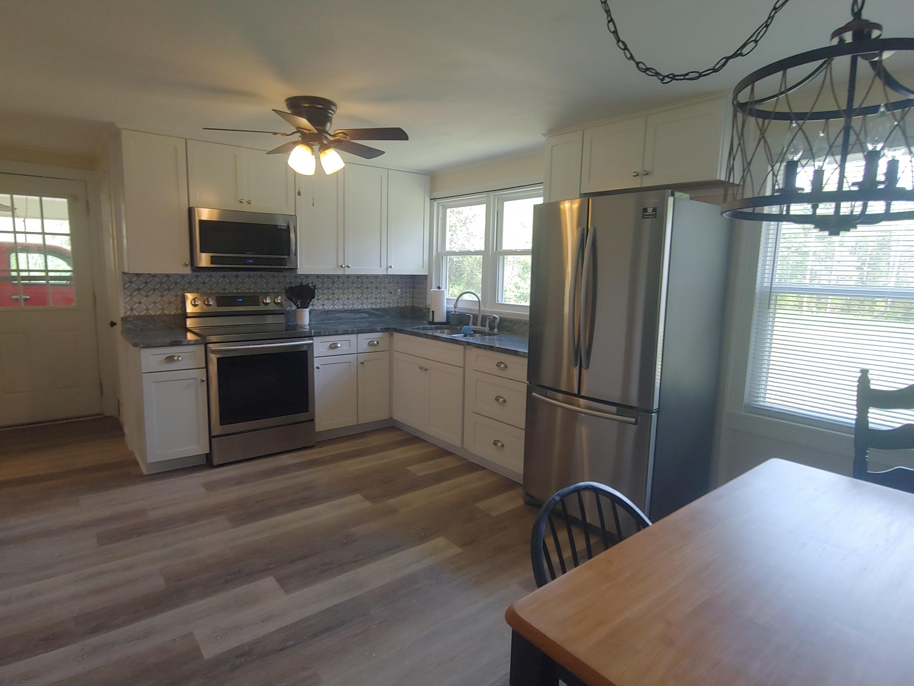 800 King Richard Road Ferrum, VA 24088 - Photo 6 of 17 a kitchen with stainless steel appliances granite countertop a refrigerator a stove a sink and a microwave