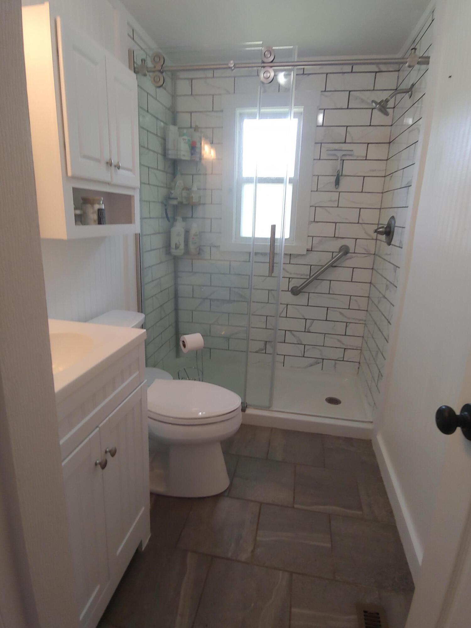 800 King Richard Road Ferrum, VA 24088 - Photo 9 of 17 a bathroom with a toilet a sink and shower