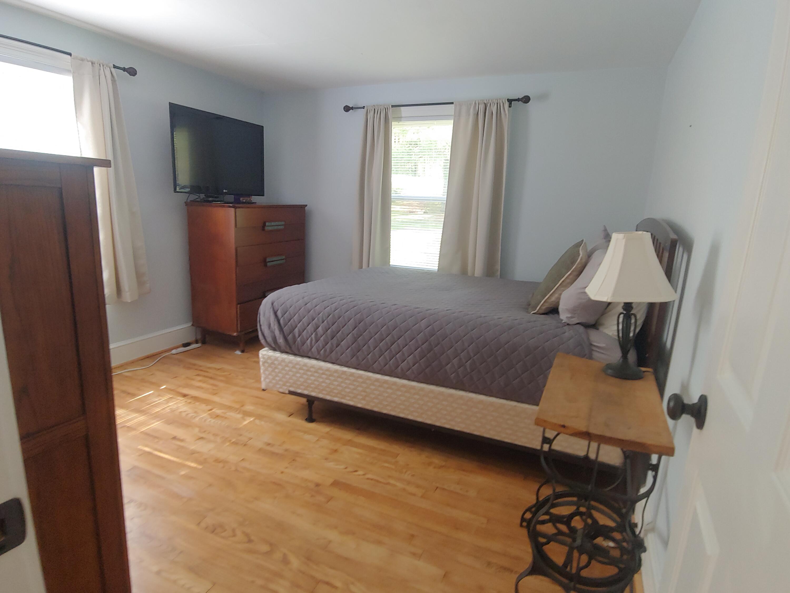 800 King Richard Road Ferrum, VA 24088 - Photo 10 of 17 a bedroom with a bed and a flat screen tv
