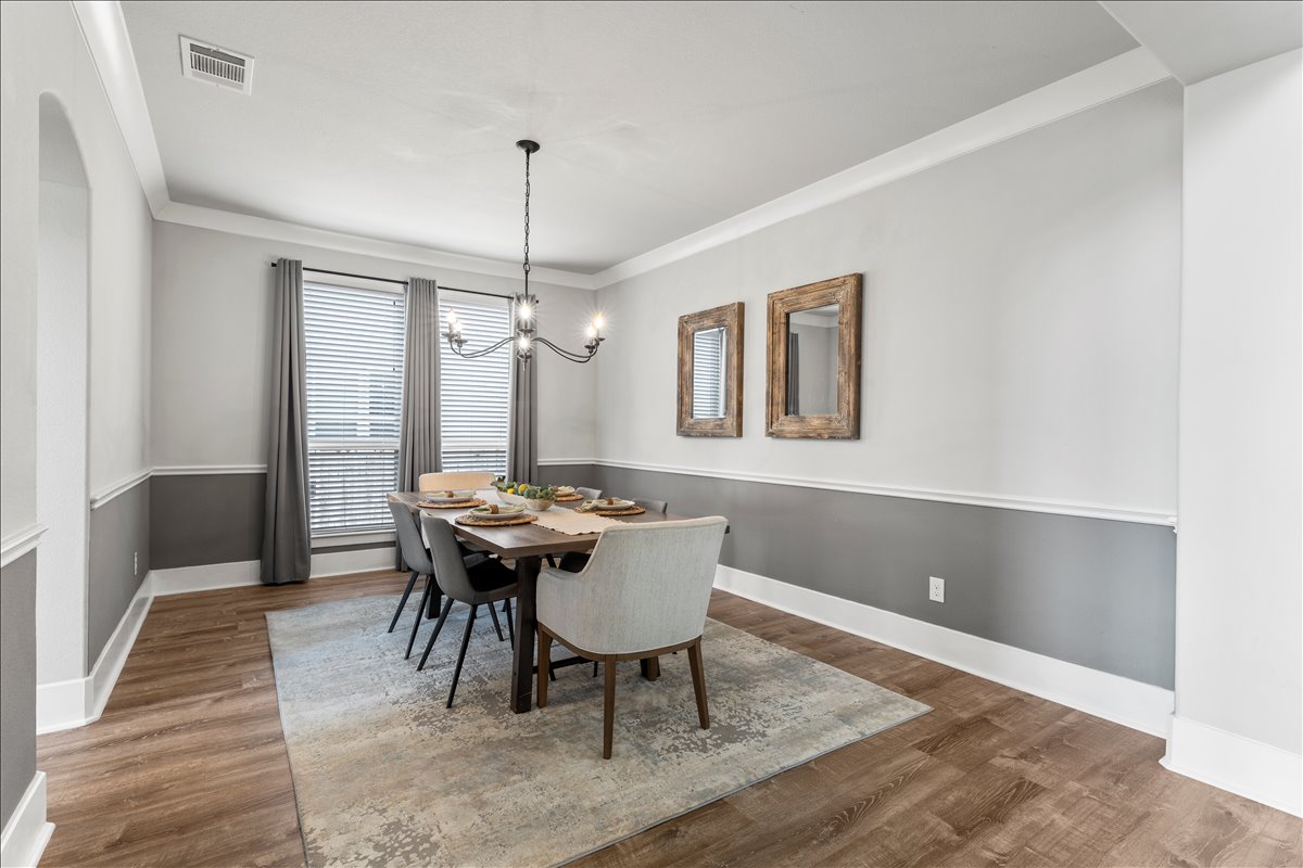 200 Draco Street Georgetown, TX 78628 - Photo 10 of 39 a view of a dining room with furniture window and wooden floor