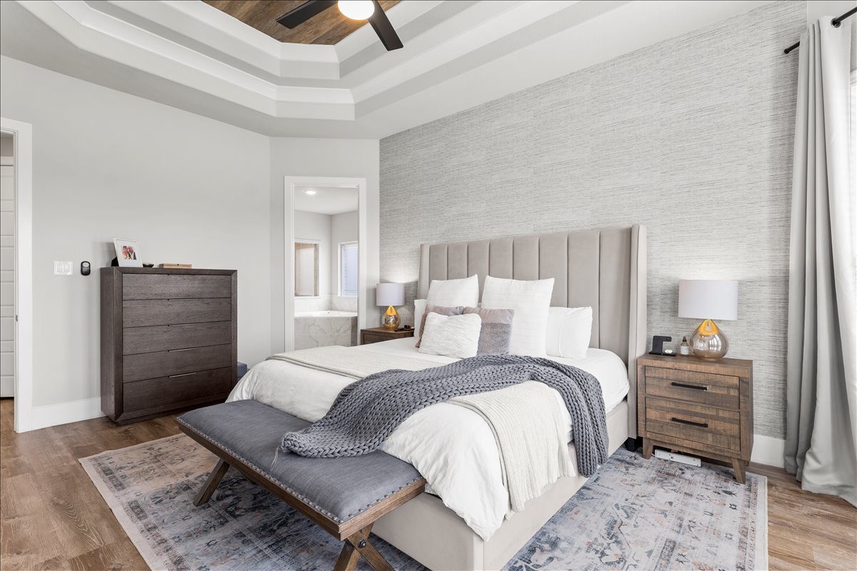 200 Draco Street Georgetown, TX 78628 - Photo 13 of 39 a bedroom with a bed and dresser