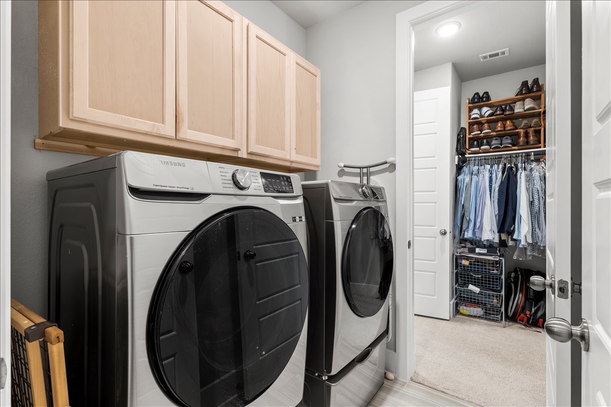 200 Draco Street Georgetown, TX 78628 - Photo 16 of 39 a view of a storage and utility room with washer and dryer