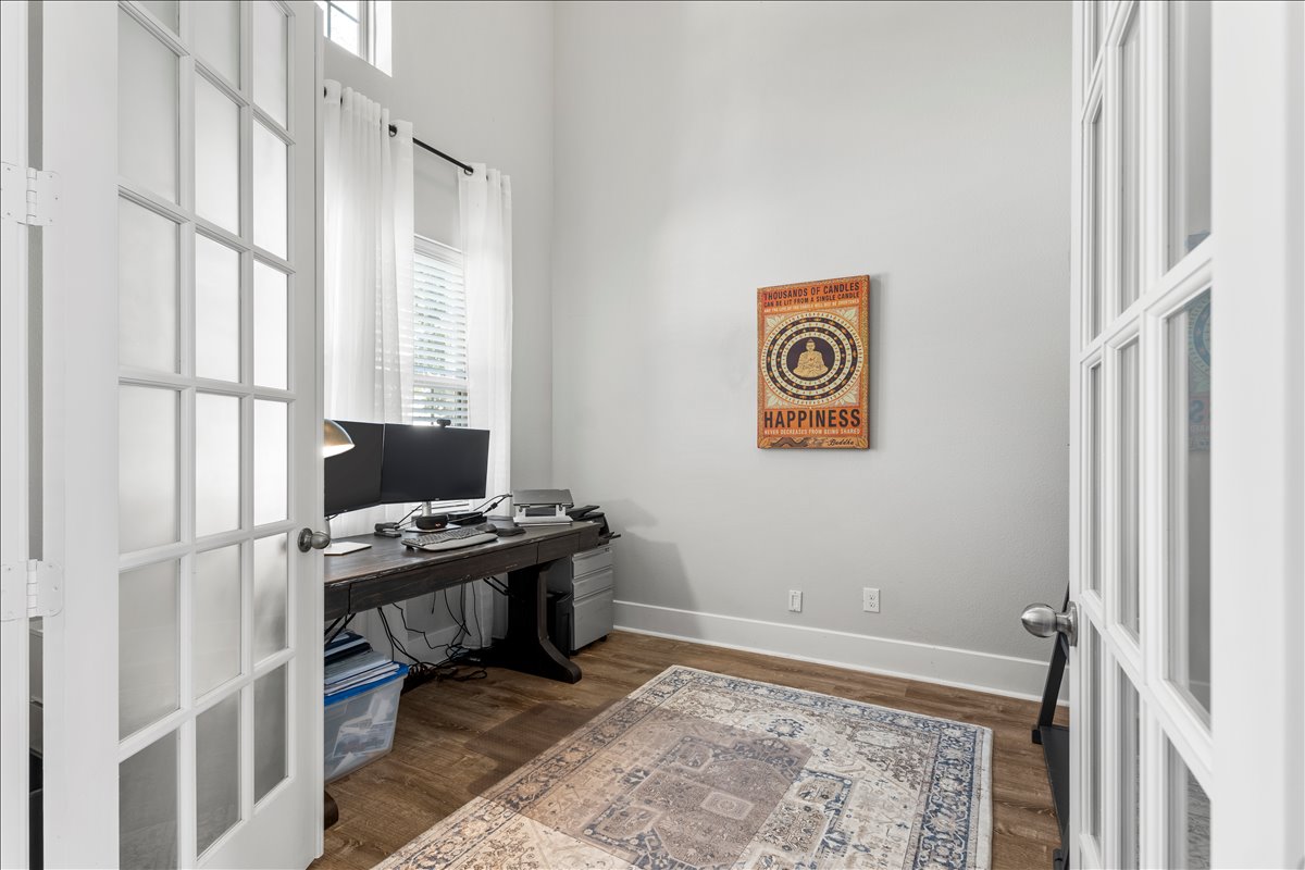200 Draco Street Georgetown, TX 78628 - Photo 20 of 39 a view of a workspace with furniture and a window