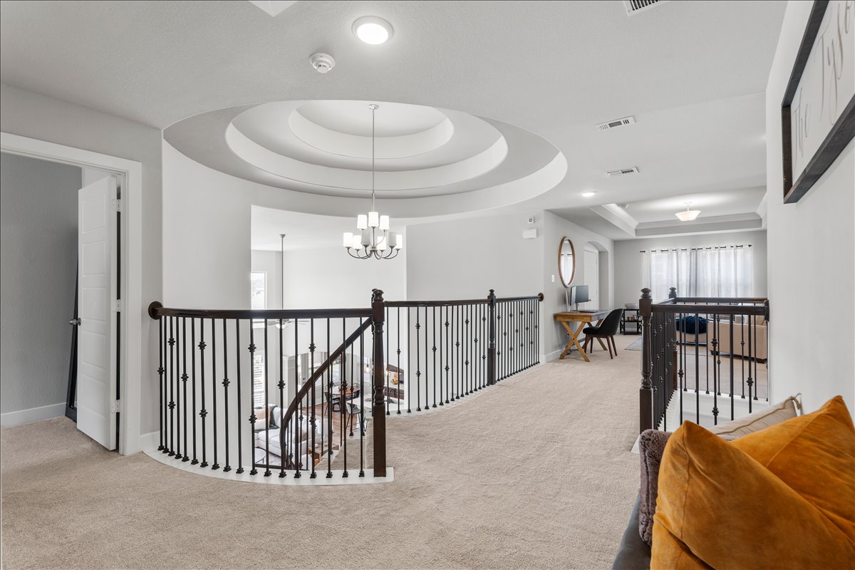 200 Draco Street Georgetown, TX 78628 - Photo 21 of 39 a view of a livingroom with furniture and a chandelier