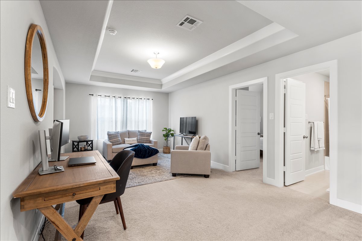 200 Draco Street Georgetown, TX 78628 - Photo 22 of 39 a living room with furniture a mirror and a window