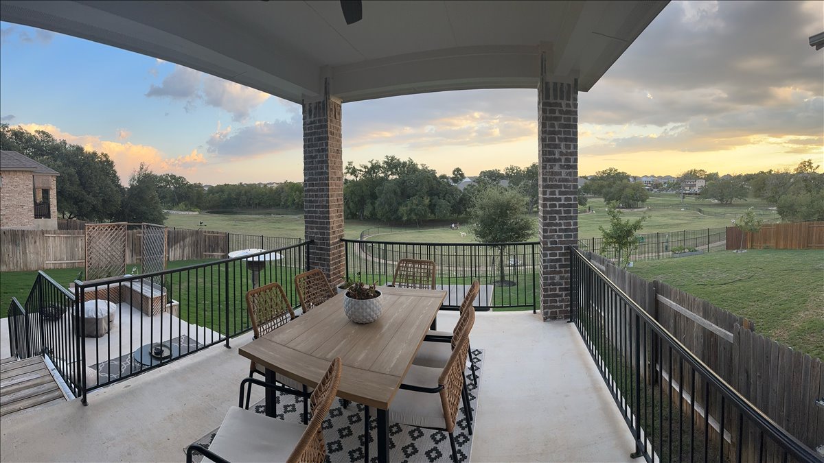 200 Draco Street Georgetown, TX 78628 - Photo 30 of 39 a view of a balcony with couch and wooden floor