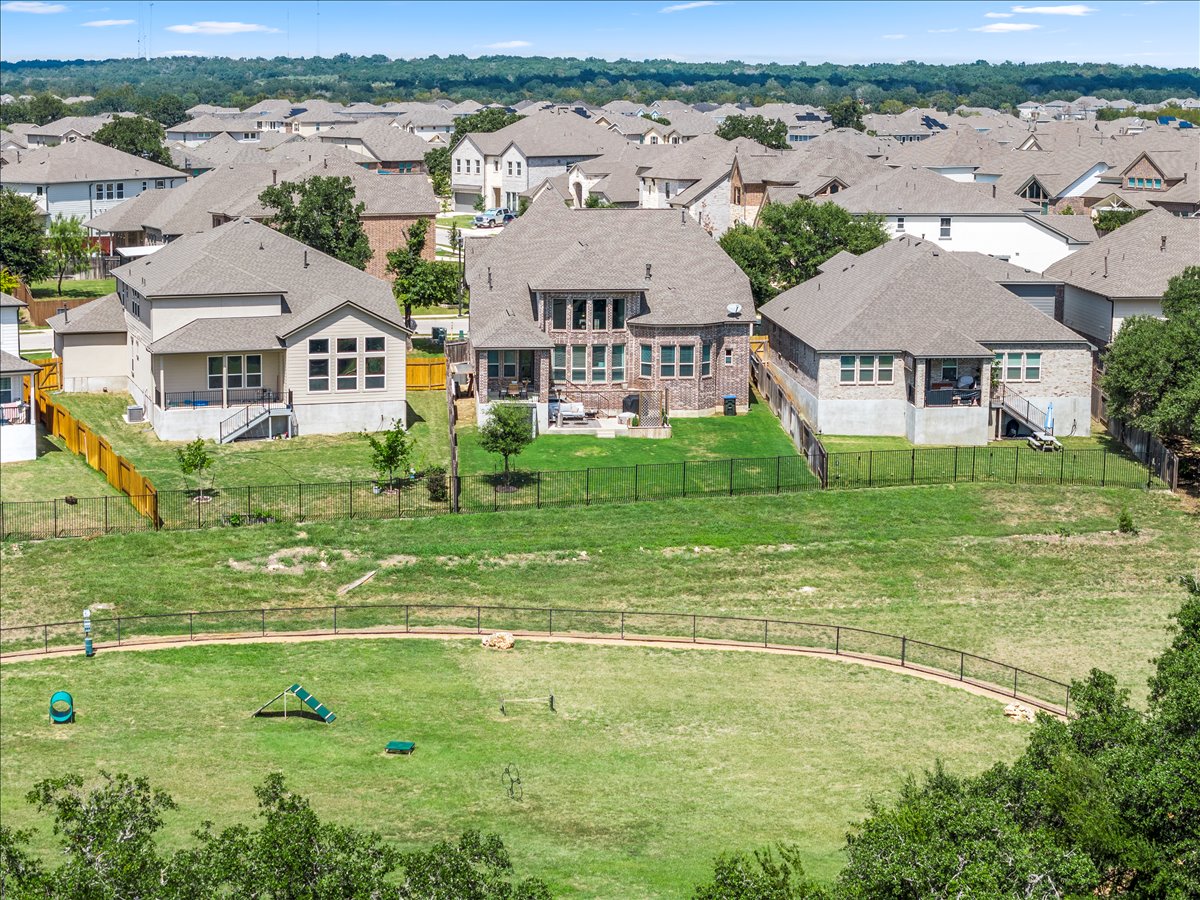 200 Draco Street Georgetown, TX 78628 - Photo 34 of 39 an aerial view of residential houses with outdoor space and trees